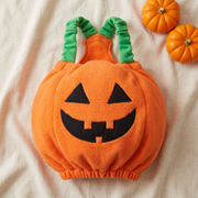 The Plumpkin costume laid flat, showing the plush pumpkin shell and its two green elastic straps